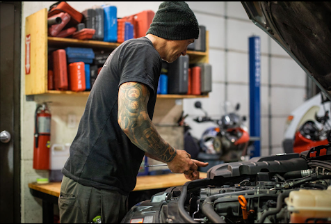 Kory Scroggins diagnosing an engine bay at Dark Horse Performance in Ferndale, WA
